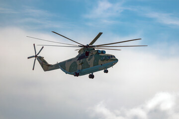 A russian heavy transport helicopter Mi-26 flying in the air