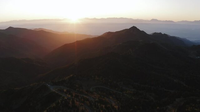 Dramatic mountain sunset aerial flight. Drone top view, Shiga Kogen / 志賀高原 空撮 ドローン撮影 / 4K Cinematic