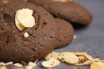 almond nut chocolate cookies on wooden table 