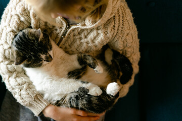 young girl holding her cat