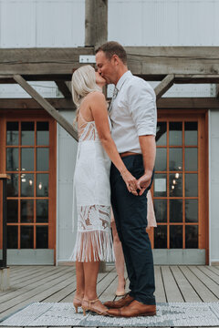 Bride and Groom Kiss at Conclusion of Wedding Ceremony
