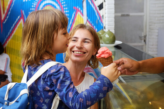 Portrait of a mother with a child buying ice cream