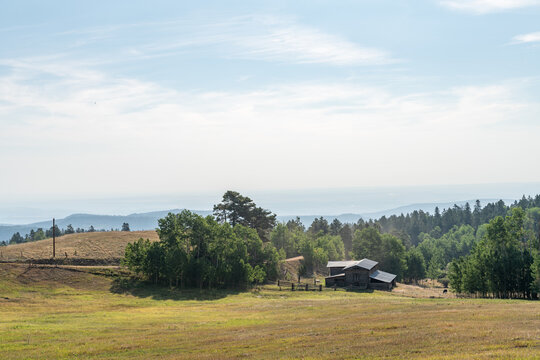A farmhouse on a rural hillside