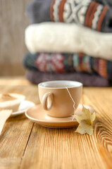 Autumn tea in warm colors with knitted sweaters