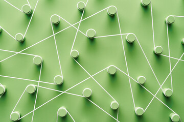 Green pegs connected with rope