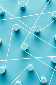 White rope connections amidst pegs