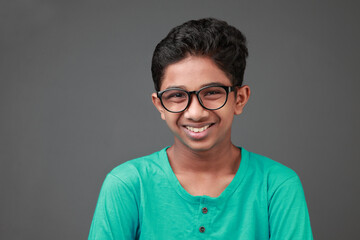 Young boy of Indian origin with a smiling face 