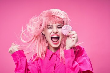 cheerful woman with pink hair sweets enjoyment model