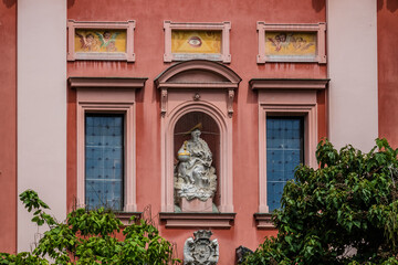Fototapeta na wymiar Franciscan Church of Annunciation (1646 - 1660) located on Preseren Square in Ljubljana - capital of Slovenia. Its red color is symbolic of the Franciscan monastic order.