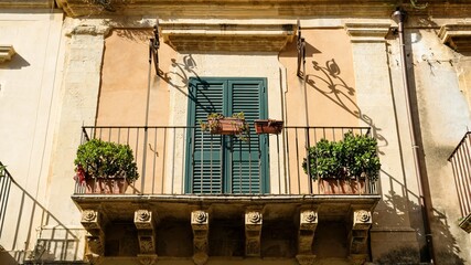 Noto, Sicily. Like in old times, many balconies are closed after lunch time.