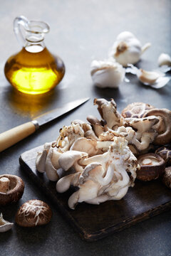 Oyster and Shiitake Mushrooms on a Cutting Board