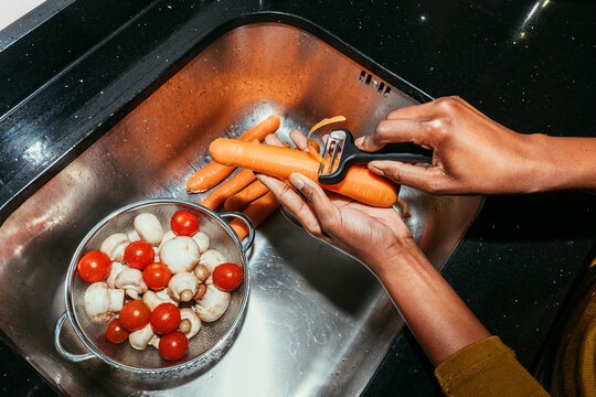 Woman Peeling a Carrot
