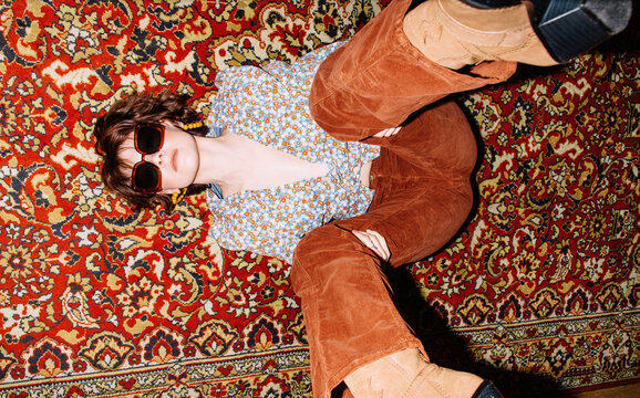 Retro fashion model posing on carpet
