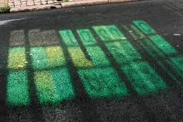 Sun reflections on asphalt