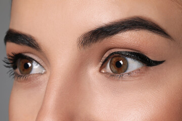 Beautiful woman with black eyeliner, closeup view