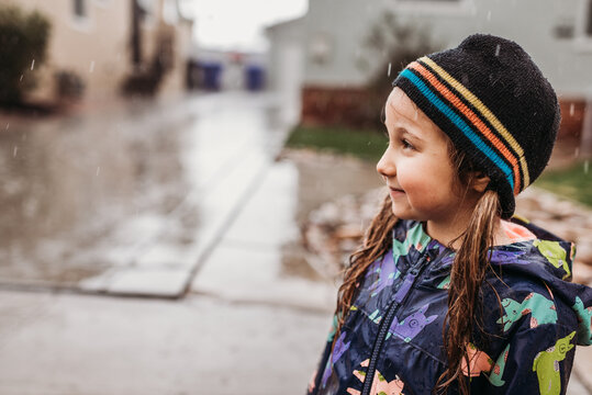 Portrait of little girl in rain 