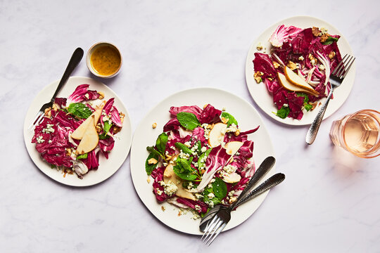 Three Plates of Radicchio and Pear Salad with Dressing