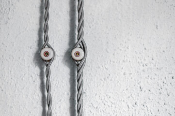 Fototapeta na wymiar Decorative vintage wiring on grunge walls, detail