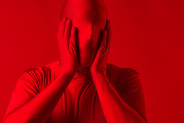 crazy screaming red man on a red background. figure in a leotard