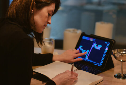 a woman is engaged in stock trading