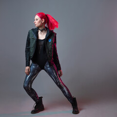 Futuristic fashion, a young bright and attractive woman with pink hair,
