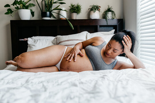 A portrait of an African American woman expecting / pregnant