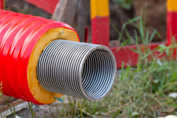 The red pipe is prepared for the replacement of the water supply. Replacement of the city pipeline.