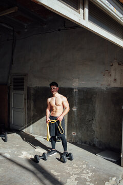 young man training in his garage
