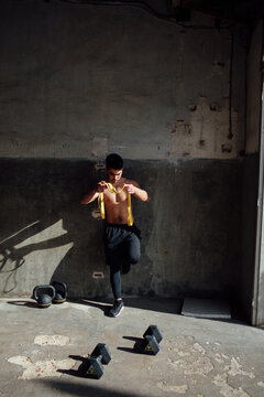 young man training in his garage