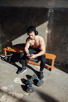 young man training in his garage