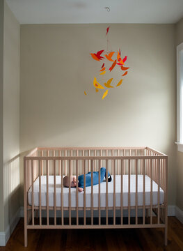 Sleeping Baby in Crib in Nursery