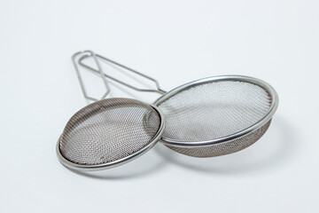 Kitchen sieve on a white background. Small steel sieve