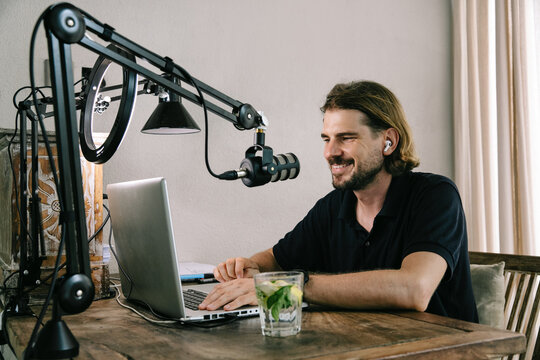 Profile of Smiling Digital Nomad at Work