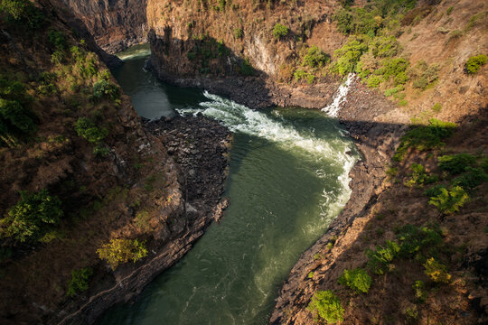 Aerial Overview of a River Leading through a Canyon