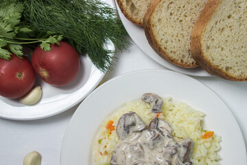 Pilaf with mushroom gravy in a creamy sauce. Delicious and healthy food. Vegetarian dish.