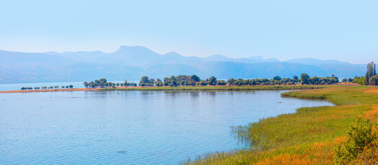 Beautiful landscape with tranquil water of Egridir lake, Blue Mountains in the background - Isparta,Turkey