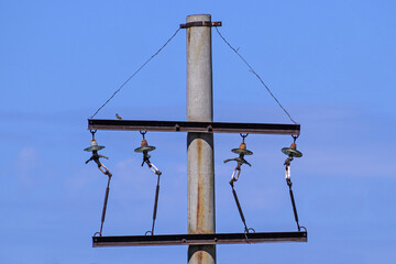 The upper part of the old power line support without wires
