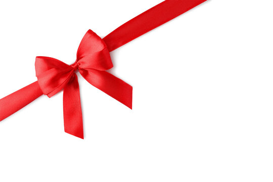 Red bow and ribbon on white background, top view