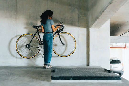 Woman Taking Parked Bike