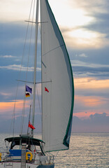 Fototapeta premium Sailing Yacht from sail regatta on mediterranean sea at sunset - Sailing luxury yacht with white sails in the Sea.