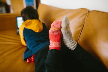 Childs feet with mismatched socks
