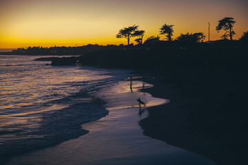 Surfer headed to the water