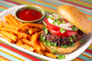 Plant based black bean  burger with sweet potato fries