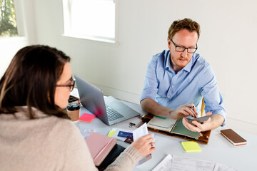 Couple Spends Time Calculating Annual Expenses To Prepare For Taxes