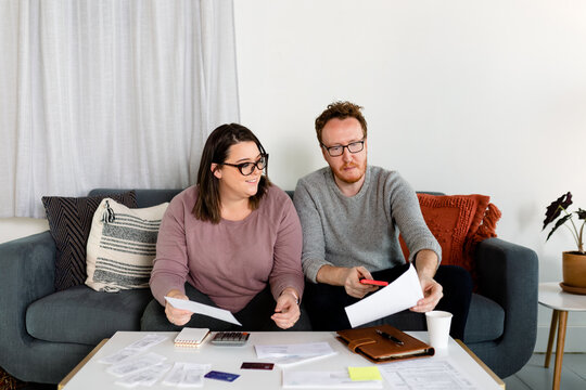 Middle Aged Couple Closing in on Finished Their Annual Tax Preparation