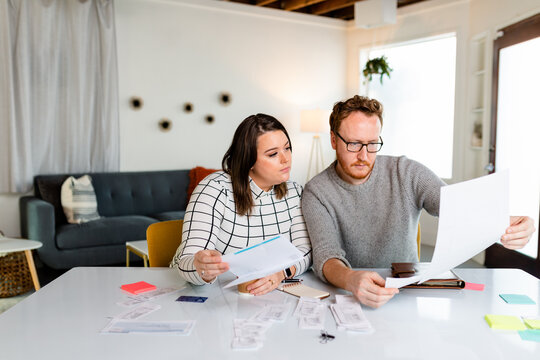 Couple Prepares to File Their Taxes at Home
