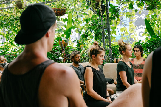 Group of People Meditating Together Outdoors