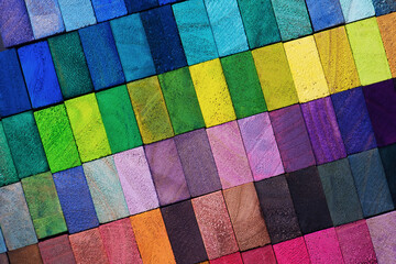 Spectrum of multi colored wooden blocks aligned. Background or cover for something creative or...