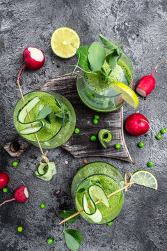 Green smoothie. Detox smoothie, green fresh peas, cucumber, radish, spinach and lime. vertical image. top view