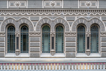 Arched windows with stucco on a 19th century Empire style building. The building of the National Bank of Ukraine - Kyiv, Ukraine.